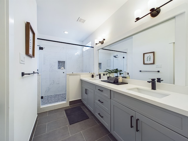 3004 Jensen Springs Ln, Houston, TX 77026 - full bathroom featuring a marble finish shower, double vanity, tile patterned floors, and recessed lighting