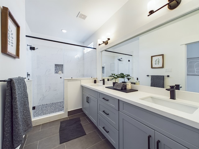 3004 Jensen Springs Ln, Houston, TX 77026 - bathroom with a marble finish shower, double vanity, tile patterned flooring, and recessed lighting