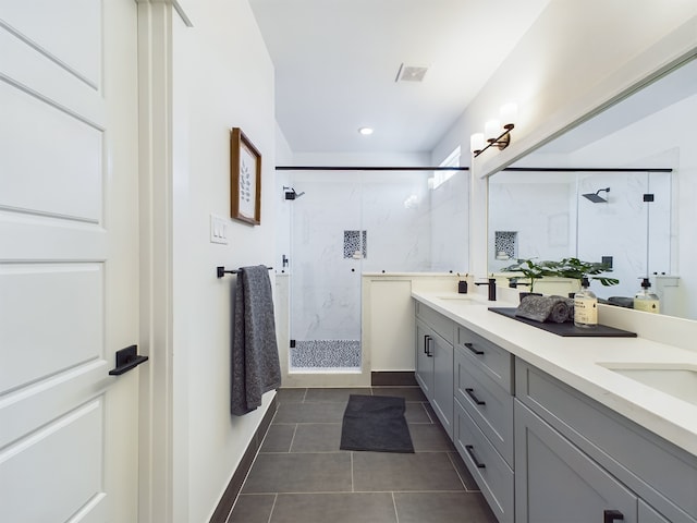 3004 Jensen Springs Ln, Houston, TX 77026 - full bath with double vanity, a marble finish shower, tile patterned floors, and recessed lighting