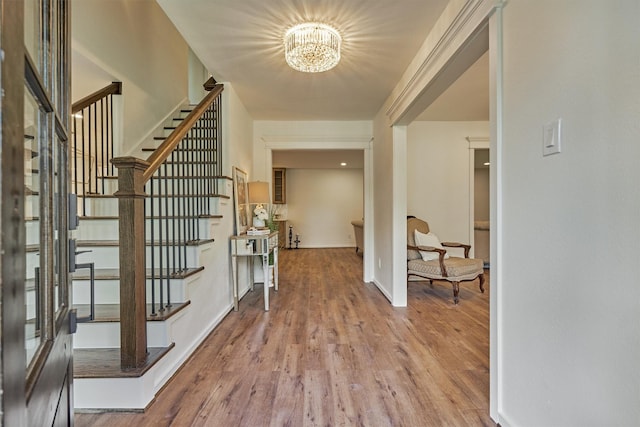 6326 Bayonne Dr, Spring, TX 77389 - foyer featuring a chandelier, stairs, wood finished floors, and baseboards