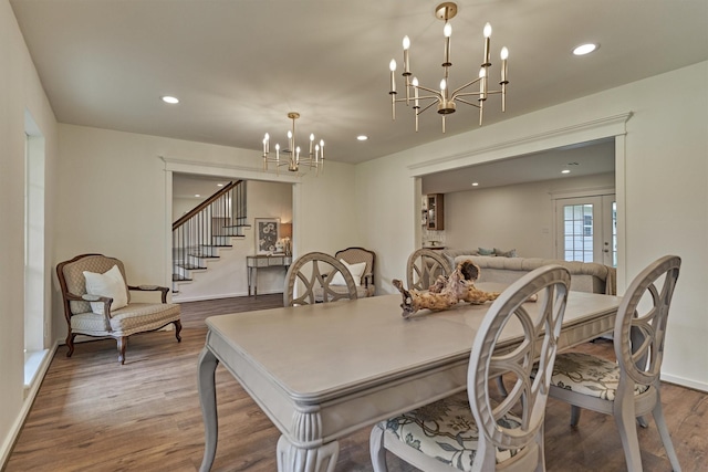 6326 Bayonne Dr, Spring, TX 77389 - dining area with a chandelier, wood finished floors, stairway, and recessed lighting