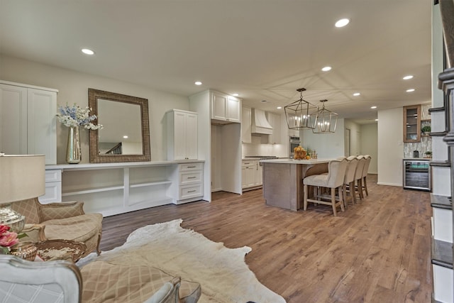 6326 Bayonne Dr, Spring, TX 77389 - living area with a chandelier, beverage cooler, recessed lighting, and dark wood finished floors