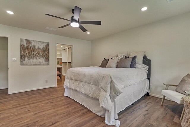 6326 Bayonne Dr, Spring, TX 77389 - bedroom featuring wood finished floors, baseboards, recessed lighting, ceiling fan, and a walk in closet