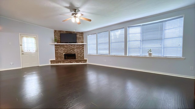 13419 Greenway Dr, Sugar Land, TX 77498 - unfurnished living room with ceiling fan, wood finished floors, a fireplace, and baseboards