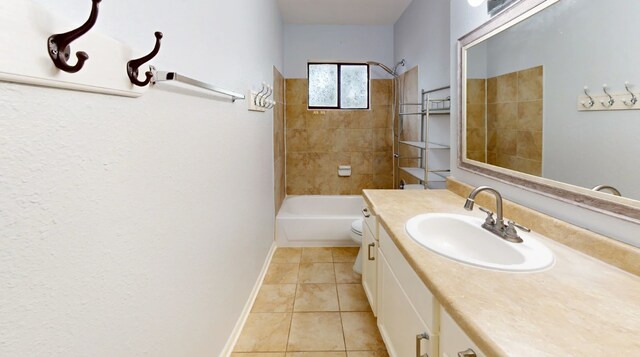 13419 Greenway Dr, Sugar Land, TX 77498 - bathroom with tile patterned floors, vanity, baseboards, toilet, and washtub / shower combination
