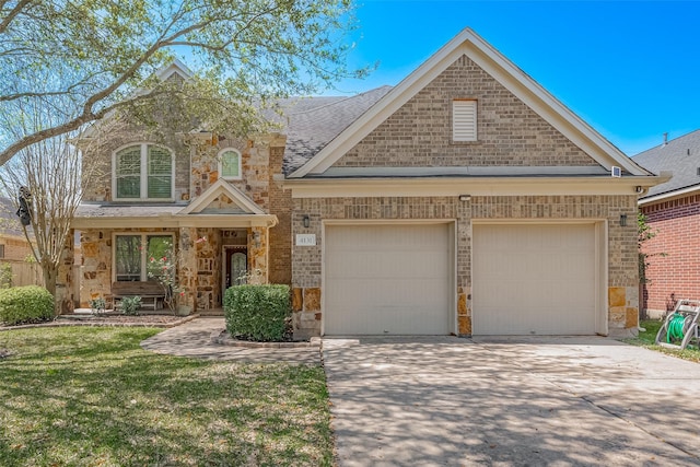 4131 Regal Stone Ln, Sugar Land, TX 77479 - view of front of home featuring concrete driveway, an attached garage, stone siding, and brick siding