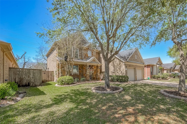 4131 Regal Stone Ln, Sugar Land, TX 77479 - view of front of house with a garage, brick siding, driveway, and stone siding