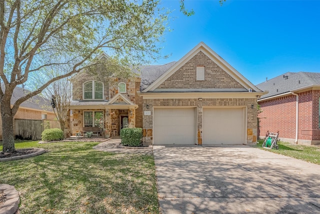 4131 Regal Stone Ln, Sugar Land, TX 77479 - view of front of property with concrete driveway, a garage, brick siding, and stone siding
