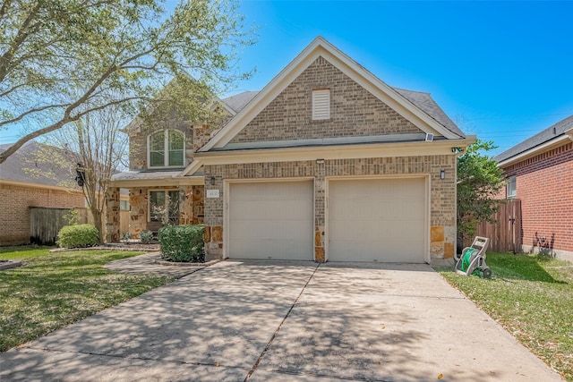 4131 Regal Stone Ln, Sugar Land, TX 77479 - view of front of house featuring brick siding, stone siding, driveway, and a garage