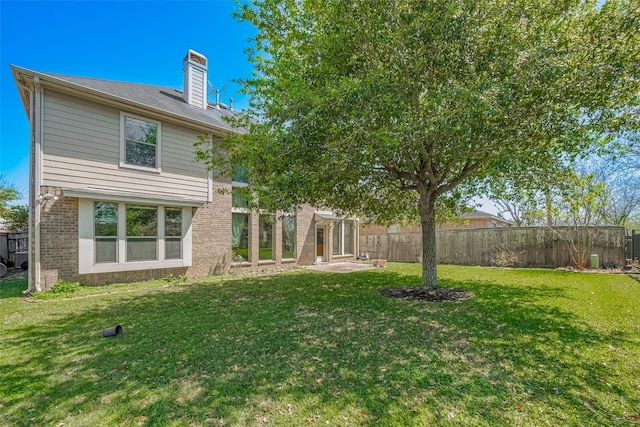 4131 Regal Stone Ln, Sugar Land, TX 77479 - back of house with brick siding and a chimney