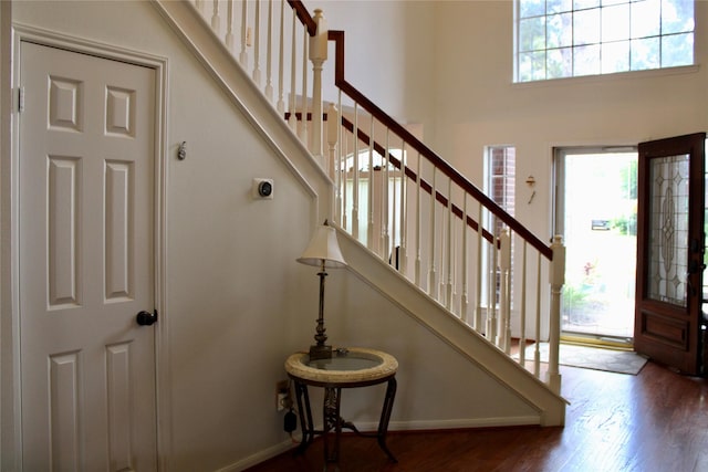 3231 Brinton Trails Ln, Katy, TX 77494 - entryway with stairway, wood finished floors, baseboards, and a towering ceiling