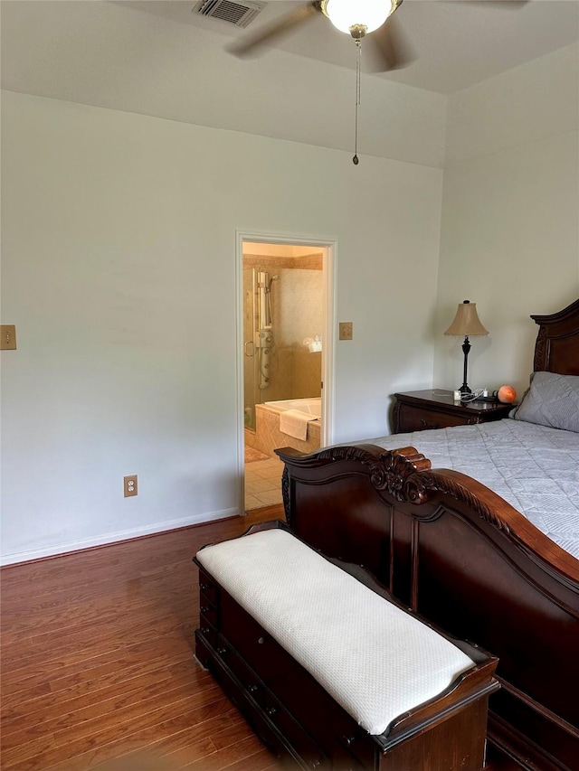 3231 Brinton Trails Ln, Katy, TX 77494 - bedroom with wood finished floors, ensuite bathroom, baseboards, and ceiling fan