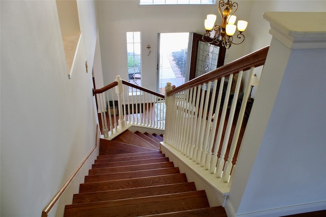 3231 Brinton Trails Ln, Katy, TX 77494 - staircase with a chandelier
