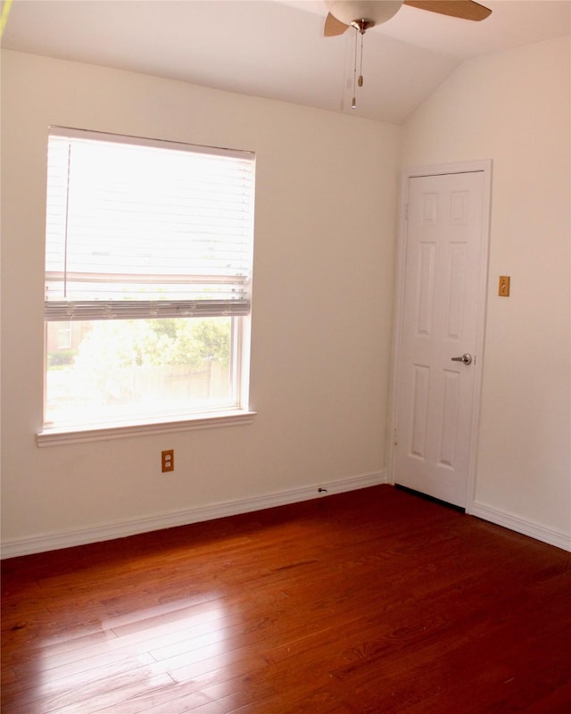 3231 Brinton Trails Ln, Katy, TX 77494 - unfurnished room with dark wood-type flooring, ceiling fan, vaulted ceiling, and baseboards