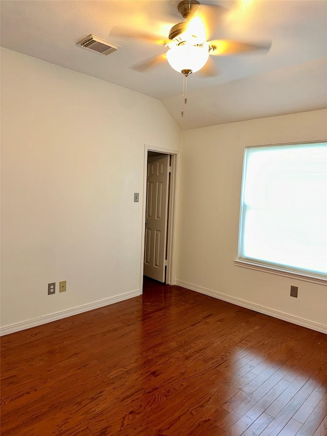 3231 Brinton Trails Ln, Katy, TX 77494 - unfurnished room with dark wood-style floors, ceiling fan, baseboards, and vaulted ceiling