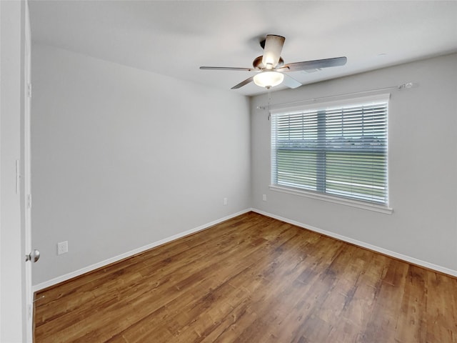 8022 Scanlan Trce, Missouri City, TX 77459 - spare room with a ceiling fan, wood finished floors, and baseboards