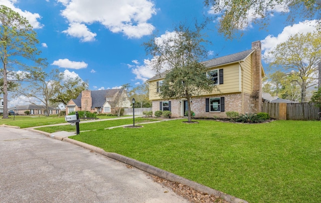 7514 Renmark Ln, Houston, TX 77070 - colonial-style house featuring brick siding, a chimney, and a residential view