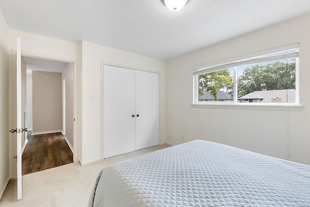 7514 Renmark Ln, Houston, TX 77070 - carpeted bedroom featuring a closet and baseboards