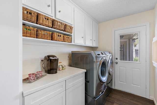 7514 Renmark Ln, Houston, TX 77070 - washroom with cabinet space, washing machine and clothes dryer, dark wood finished floors, and a textured ceiling