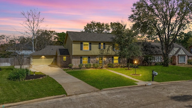 7514 Renmark Ln, Houston, TX 77070 - colonial home featuring concrete driveway, brick siding, and a garage