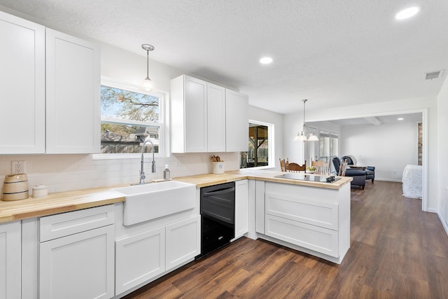 7514 Renmark Ln, Houston, TX 77070 - kitchen with black appliances, wooden counters, a peninsula, open floor plan, and recessed lighting