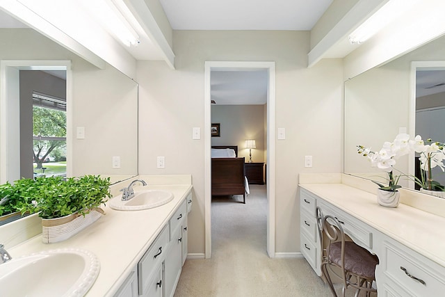7514 Renmark Ln, Houston, TX 77070 - ensuite bathroom featuring double vanity and baseboards