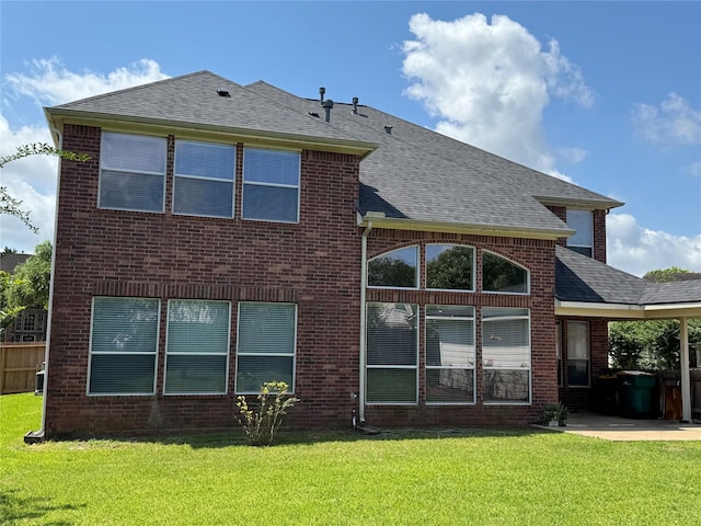 11703 Sterling Brook St, Pearland, TX 77584 - back of property with a patio, roof with shingles, and brick siding