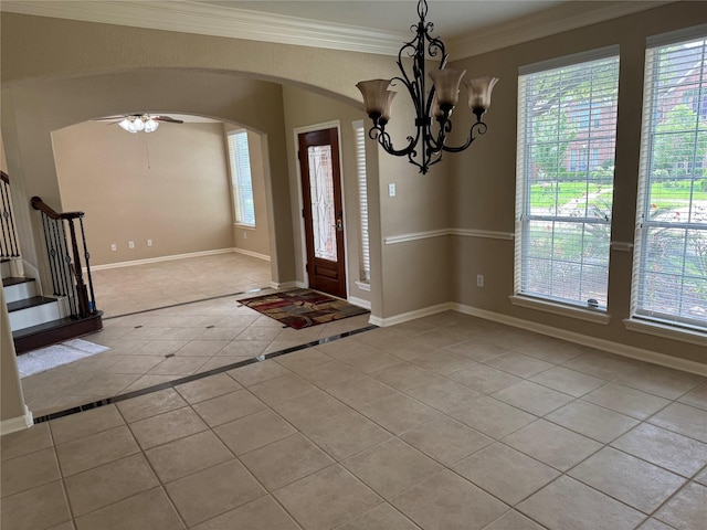 11703 Sterling Brook St, Pearland, TX 77584 - entryway featuring light tile patterned floors, stairway, arched walkways, ornamental molding, and inlaid floor details