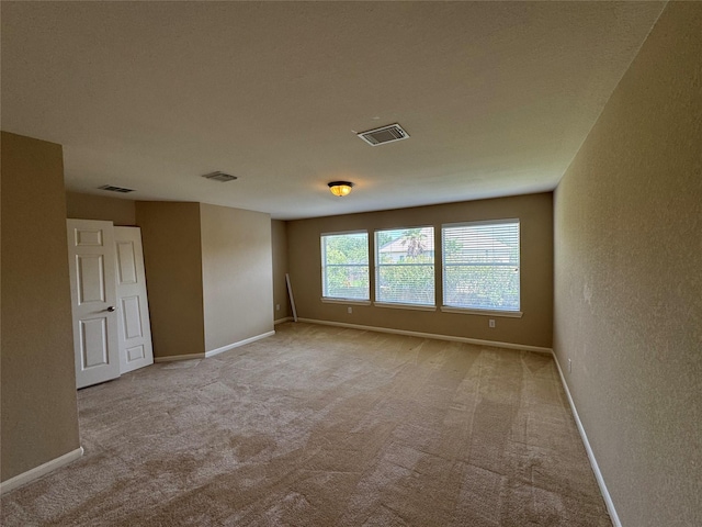 11703 Sterling Brook St, Pearland, TX 77584 - carpeted spare room with a textured wall and baseboards