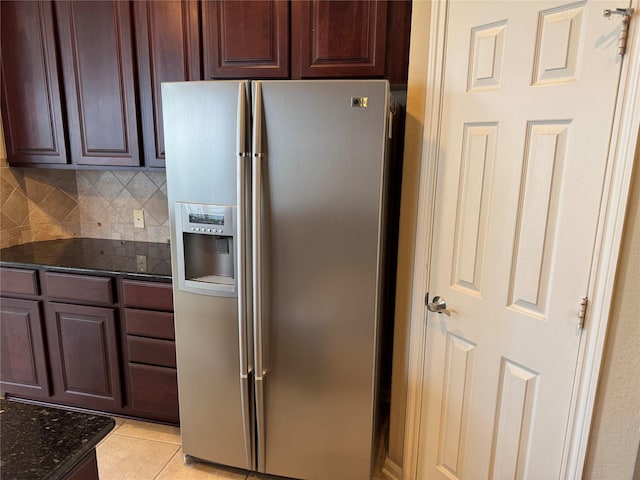 11703 Sterling Brook St, Pearland, TX 77584 - kitchen featuring stainless steel refrigerator with ice dispenser, dark stone counters, light tile patterned floors, backsplash, and dark brown cabinetry