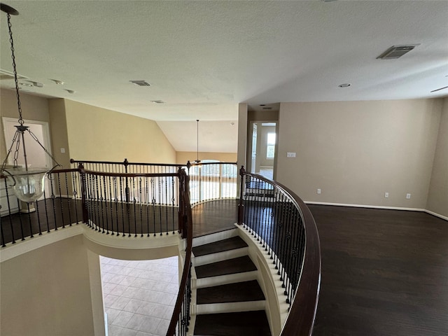11703 Sterling Brook St, Pearland, TX 77584 - stairway featuring a chandelier, wood finished floors, and baseboards