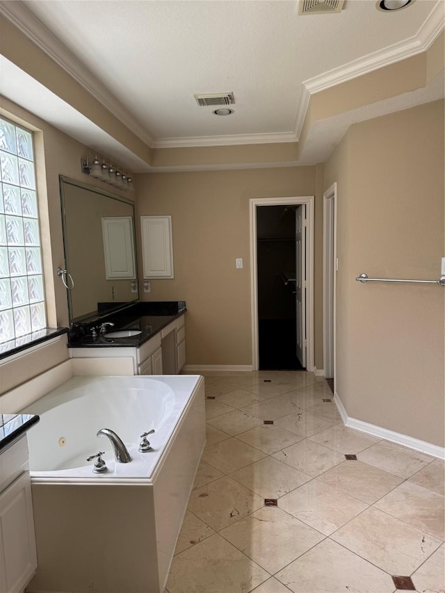 11703 Sterling Brook St, Pearland, TX 77584 - bathroom with vanity, a whirlpool tub, ornamental molding, and baseboards