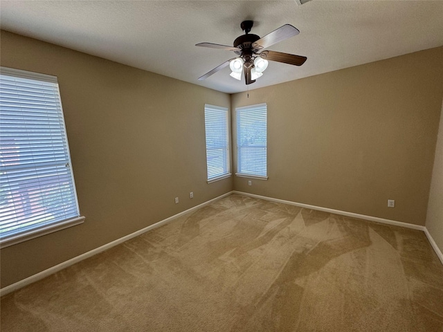 11703 Sterling Brook St, Pearland, TX 77584 - unfurnished room with light colored carpet, ceiling fan, and baseboards