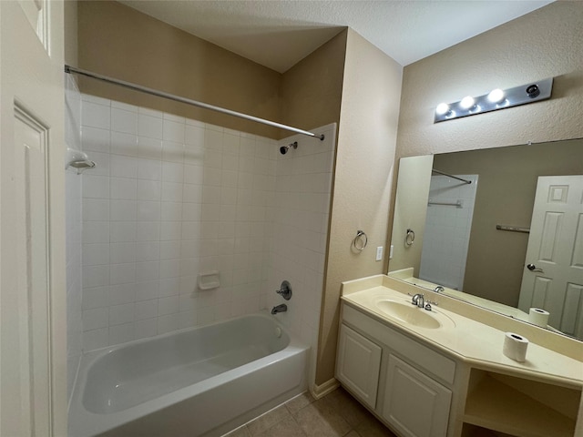 11703 Sterling Brook St, Pearland, TX 77584 - bathroom with tile patterned floors,  shower combination, vanity, and a textured wall