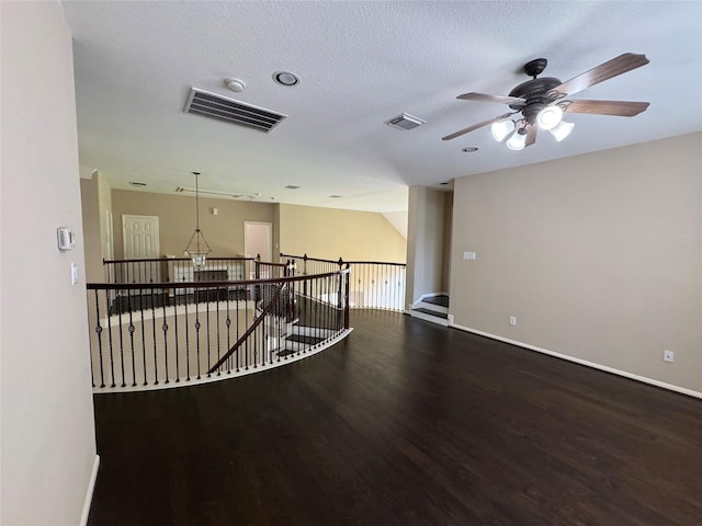 11703 Sterling Brook St, Pearland, TX 77584 - spare room featuring wood finished floors, ceiling fan, baseboards, and a textured ceiling