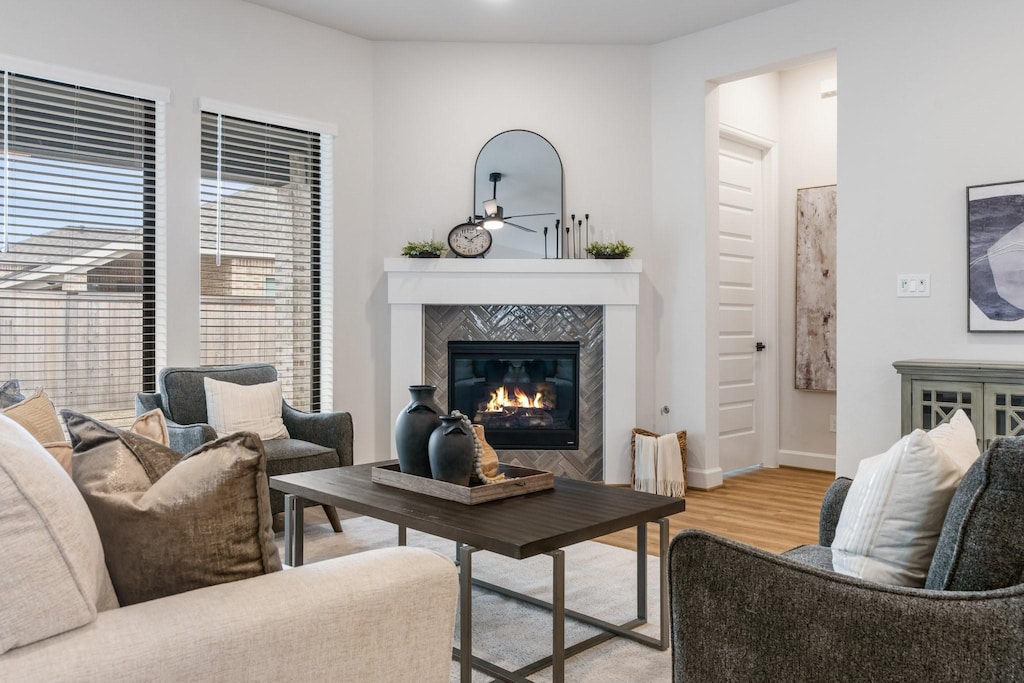12706 Rusty Blackhaw Ct, Cypress, TX 77433 - living area with wood finished floors, a tile fireplace, and ceiling fan