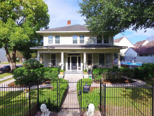 1401 Truxillo St, Houston, TX 77004 - view of front facade featuring covered porch, a gate, and a chimney