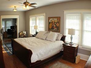 1401 Truxillo St, Houston, TX 77004 - bedroom with dark wood-style floors and baseboards