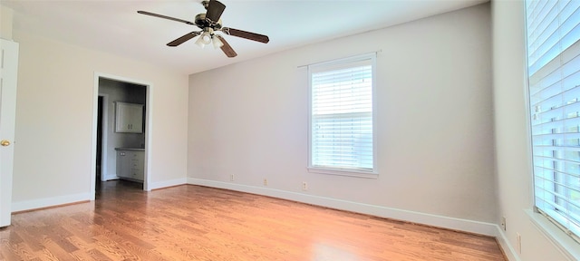 1401 Truxillo St, Houston, TX 77004 - unfurnished bedroom featuring multiple windows, light wood-type flooring, and baseboards