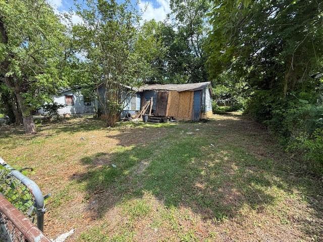 2406 Mierianne St, Houston, TX 77093 - view of green lawn featuring an outdoor structure