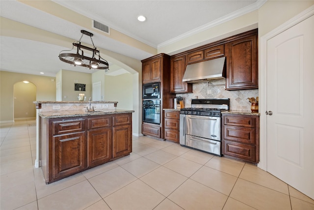 303 Winkler St, Baytown, TX 77520 - kitchen with under cabinet range hood, black appliances, arched walkways, decorative backsplash, and crown molding