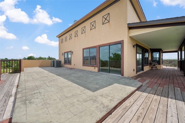 303 Winkler St, Baytown, TX 77520 - wooden terrace with central AC unit and a patio