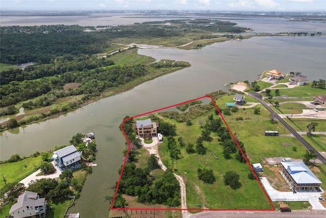 303 Winkler St, Baytown, TX 77520 - aerial overview of property's location with a large body of water and property boundaries highlighted
