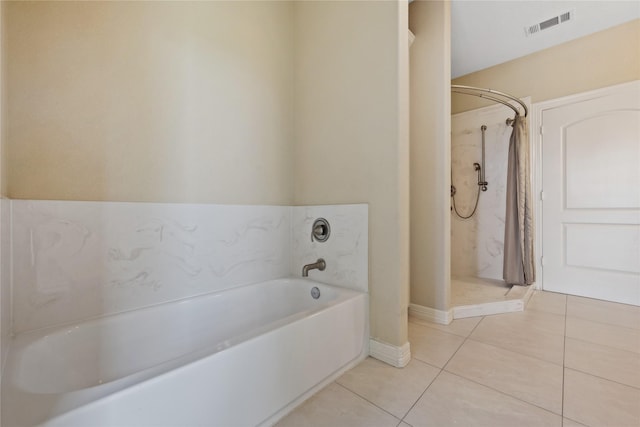 303 Winkler St, Baytown, TX 77520 - bathroom featuring tile patterned flooring, a garden tub, and curtained shower