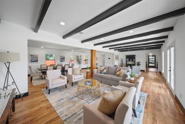 701 W 39th St, Houston, TX 77018 - living room featuring light wood finished floors, plenty of natural light, recessed lighting, baseboards, and beam ceiling
