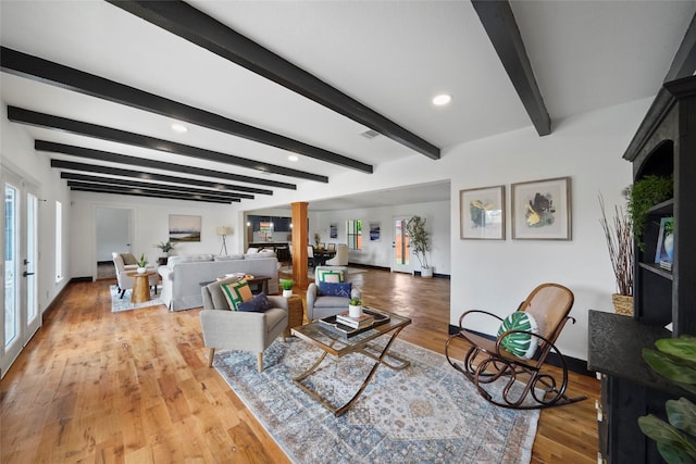 701 W 39th St, Houston, TX 77018 - living room featuring baseboards, light wood-style floors, beam ceiling, and recessed lighting