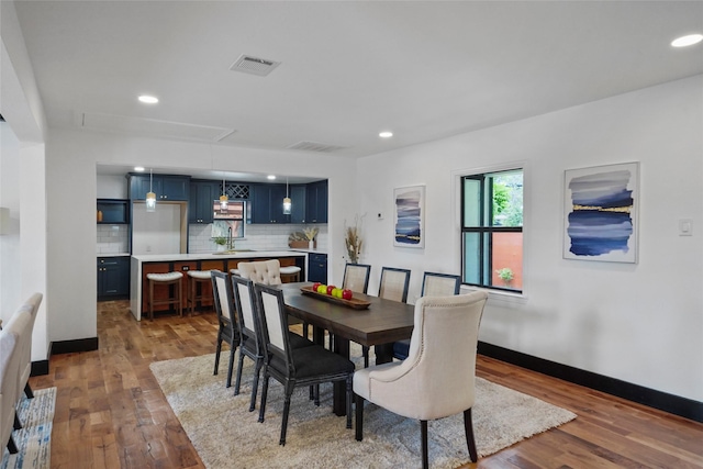 701 W 39th St, Houston, TX 77018 - dining room featuring attic access, wood finished floors, baseboards, and recessed lighting