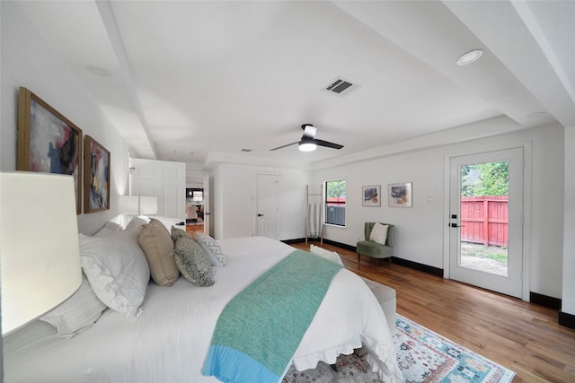 701 W 39th St, Houston, TX 77018 - bedroom with multiple windows, access to outside, wood finished floors, and baseboards