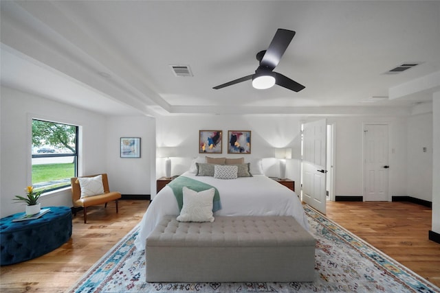 701 W 39th St, Houston, TX 77018 - bedroom featuring wood finished floors, baseboards, and ceiling fan
