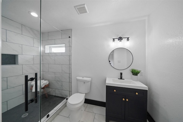 701 W 39th St, Houston, TX 77018 - bathroom with vanity, toilet, a stall shower, and baseboards